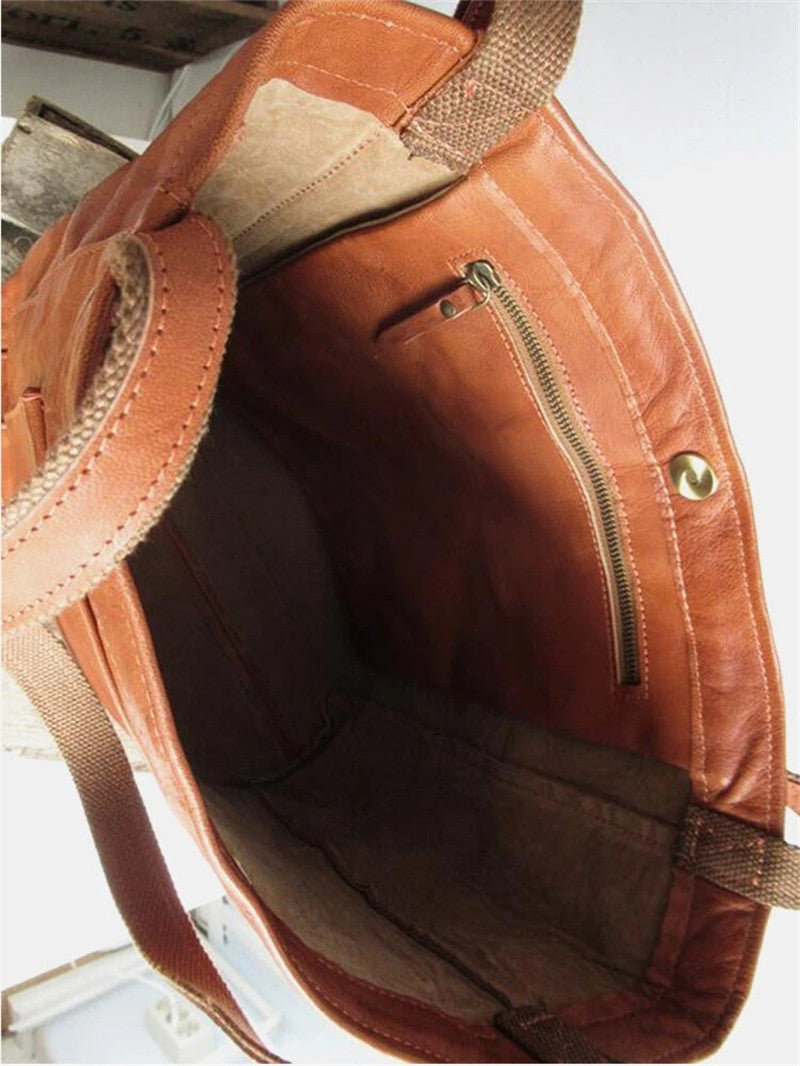 Elegant black leather handbag by Lumina Wear with spacious interior, featuring brown accents and dimensions 36x13x42cm.