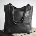 Lumina Wear Lauren elegant black leather handbag with spacious interior, showcasing its stylish design and practical size.