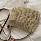 Léandre beige straw shoulder bag with vegan leather accents from Lumina Wear, stylish handbag with top handle and adjustable strap.