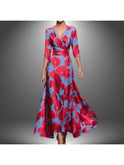 Red printed wrap dress by Lumina Wear featuring a stylish silhouette and vibrant floral pattern, perfect for casual or dressy occasions.
