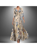 Lumina Wear Leigh printed wrap dress in red, featuring a stylish design and flattering fit, displayed on a hanger.