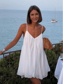 Elegant Lumina Wear Lena dress in a stylish design, shown in a medium size on a model with a fitted silhouette and intricate details.