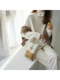 Beige Lena turtleneck sweater by Lumina Wear featuring a cozy, fitted knit design, displayed on a neutral background.