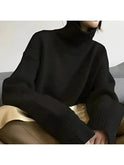 Beige Lena turtleneck sweater by Lumina Wear, featuring a cozy knit design and relaxed fit, displayed on a neutral background.