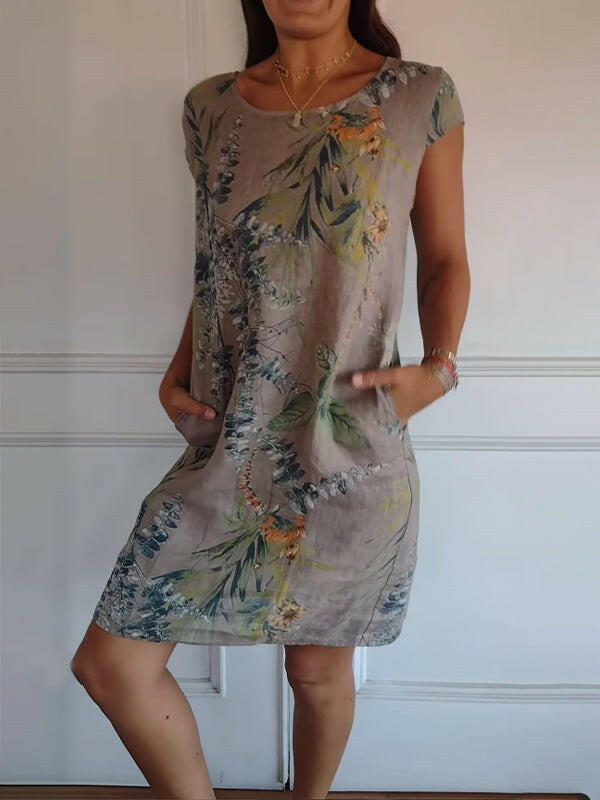 Lillian™ casual printed dress by Lumina Vancouver, featuring a white fabric with colorful floral patterns, lightweight and stylish.
