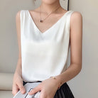Black satin tank top with V-neck by Lumina Wear, featuring a relaxed fit and classic style, perfect for casual or dressy looks.