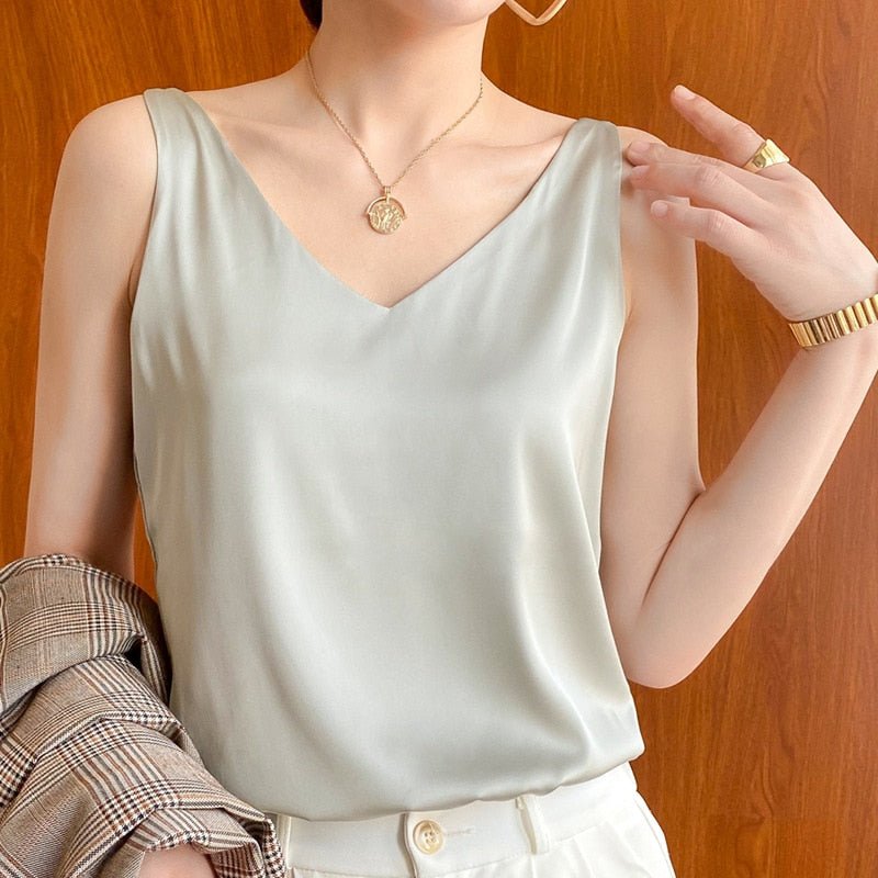 Black satin tank top with V-neck from Lumina Wear, featuring a relaxed fit and stylish design.