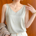Black Lumina Wear Lily satin tank top with relaxed fit and V-neck, shown on a model. Stylish and comfortable camisole.