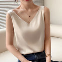 Black Lumina Wear Lily satin tank top with relaxed fit and V-neck, showcasing smooth fabric and stylish design.