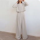 Black Lily two-piece set by Lumina Wear featuring a contemporary cropped top and wide-leg trousers.