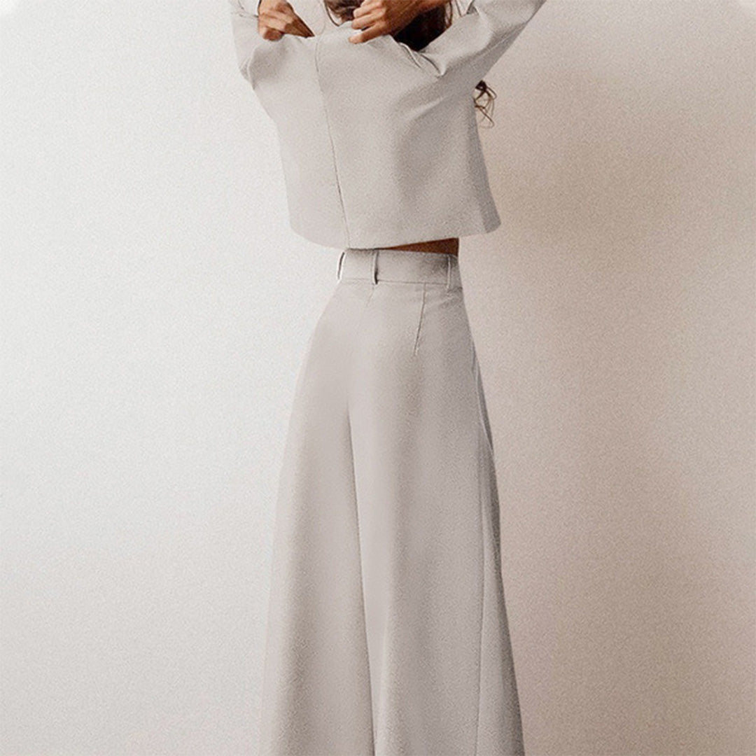 Black Lily two-piece set by Lumina Wear with a contemporary cropped top and wide-leg trousers, styled for modern elegance.