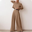 Black Lily Lumina Wear contemporary cropped top and wide-leg trousers set displayed on a model, showcasing stylish two-piece fashion.