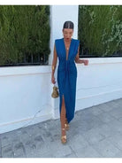 Elegant blue pleated wedding guest dress by Lumina Vancouver, featuring a stylish design perfect for special occasions.