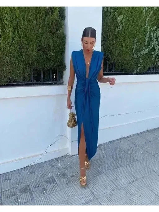 Elegant blue pleated wedding guest dress by Lumina Vancouver, featuring a stylish design perfect for special occasions.