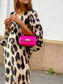 Lisa leopard print dress by Lumina Wear, featuring a stylish fit and bold animal print fabric, perfect for casual or dressy occasions.