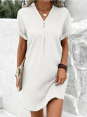 Green V-neck spring dress by Lumina Wear featuring a stylish, flowy design perfect for casual and warm-weather occasions.