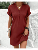 Green V-neck spring dress by Lumina Wear featuring a flowy design and short sleeves, perfect for warm weather.