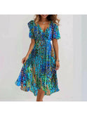 Vibrant abstract print midi dress by Lumina Wear featuring multicolored patterns, flowing fabric, and stylish design.