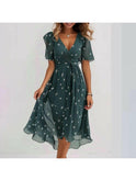 Vibrant abstract midi dress by Lumina Wear with multicolored pattern, displayed on a hanger against a plain background.