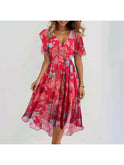 Vibrant abstract midi dress by Lumina Wear featuring multicolored patterns and a flowing silhouette, displayed on a dress form.