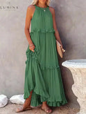 Apricot Lorena halterneck dress by Lumina Wear with ruffles and pockets, perfect for summer and holiday style.