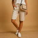 Light blue Capri pants with drawstring from Lumina Wear, shown folded on a flat surface, highlighting a relaxed fit and casual style.