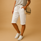 Light blue Lotte Capri trousers with drawstring by Lumina Wear, relaxed fit, casual style, front view.