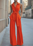 Orange sleeveless jumpsuit by Lumina Vancouver, model Lucienne, shown in XS size with a stylish, modern design.
