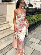 Lucy floral satin maxi dress by Lumina Vancouver, showcasing a flowy, elegant design with vibrant floral patterns.