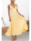 Lumina Wear Lucy yellow pleated dress, stylish and elegant, displayed on a mannequin with a flowing design and vibrant color.