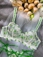 White Lovely Daisy lace lingerie set by Lumina Vancouver, 2-piece with lace detail and adjustable straps, styled on a model.