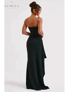 Black Ailiana Radiance Split Dress by Lumina Vancouver, showcasing elegant design and flowing fabric on a model.