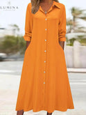 Black Charlotte button-front shirt dress by Lumina Wear, featuring a classic collar, long sleeves, and a relaxed fit.