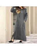 Black Lumina Wear Elisa hooded dress with a relaxed fit, featuring a hood and casual style, shown on a model.