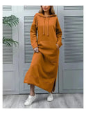 Black hooded dress from Lumina Wear's Elisa collection, featuring a casual, stylish design with a relaxed fit.