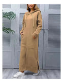 Black hooded dress by Lumina Wear featuring a relaxed fit and casual style, shown on a model.