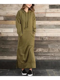 Black Lumina Wear Elisa hooded dress, featuring a relaxed fit and front pockets, displayed on a hanger.