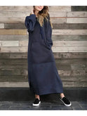 Black Lumina Wear Elisa hooded dress with long sleeves and relaxed fit, shown on a mannequin.