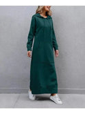 Black Lumina Wear Elisa hooded dress featuring a relaxed fit and long sleeves, displayed on a mannequin.