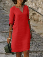 Black Lumina Vancouver Suzan elegant dress with V-neckline, flowing fabric and stylish design for formal occasions