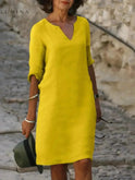 Lumina Wear Suzan elegant black dress with V-neckline, featuring a stylish and sophisticated design for formal occasions.