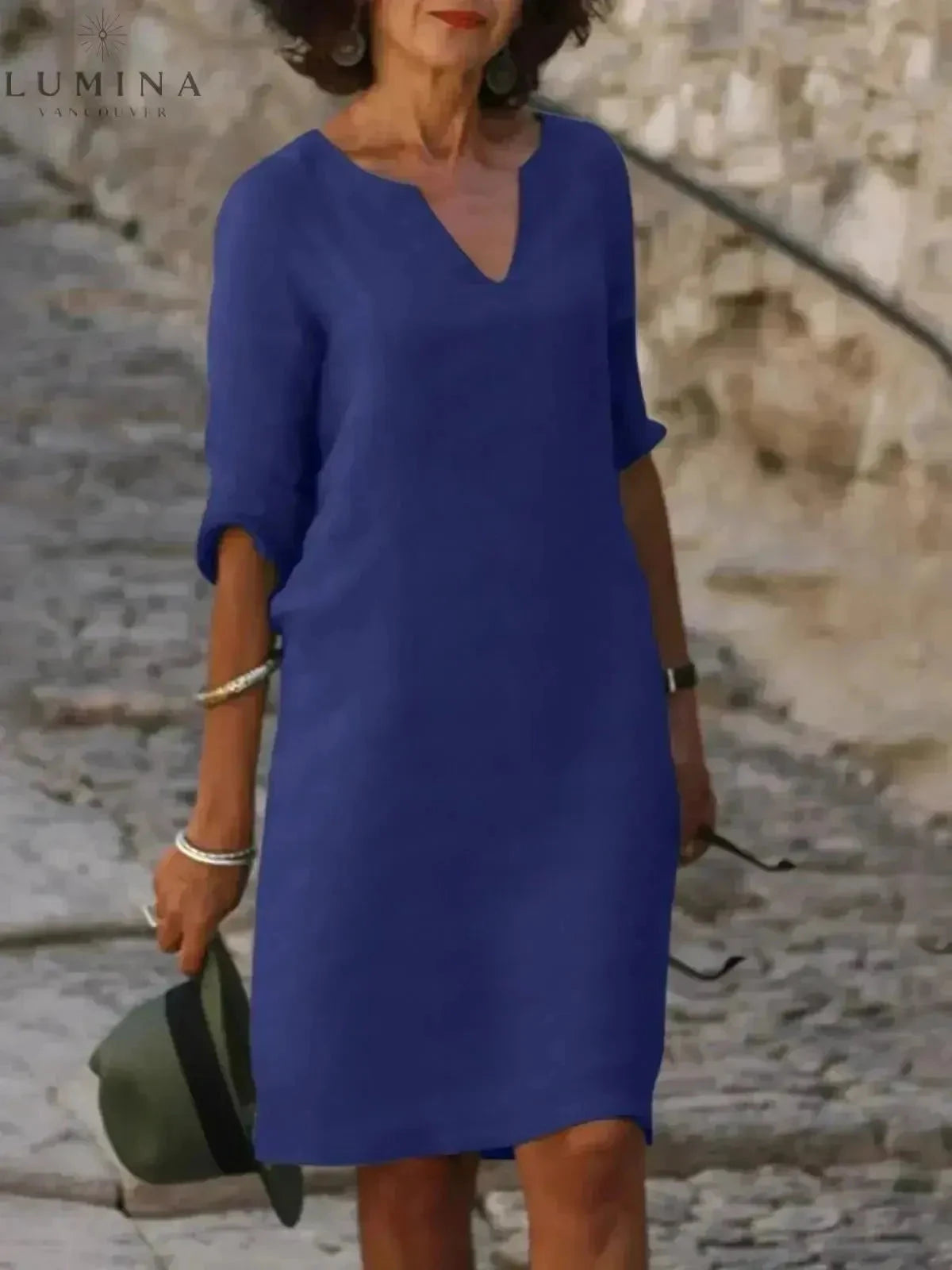 Black Lumina Vancouver Suzan elegant dress with V-neckline, featuring a stylish and sophisticated fit for formal occasions.