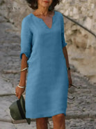 Black Lumina Vancouver Suzan elegant dress with V-neckline, featuring a stylish and sophisticated design for formal occasions.