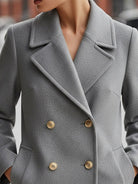 Grey Lumina Wear double-breasted wool blend blazer, tailored fit, featuring notched lapels and button closure, on a mannequin.