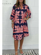 Bergljot Spring Dress by Lumina Vancouver in blue and army green, featuring a flowing design with floral accents.