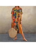 Lumina Wear Aslaug elegant multi-color floral dress with flowing fabric and vibrant floral pattern, perfect for spring and summer occasions.