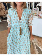 Lumina Vancouver Estrella casual blue half-sleeve maxi dress displayed on a model, featuring a relaxed fit and elegant style.