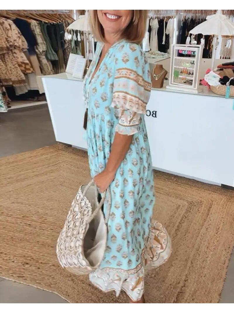 Lumina Wear Estrella casual half-sleeve blue maxi dress displayed on a model, flowing fabric and relaxed fit.