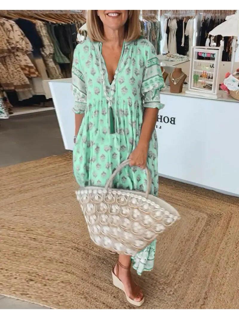 Blue Estrella casual half-sleeve maxi dress by Lumina Vancouver displayed on a model. Flowing fabric and relaxed fit.