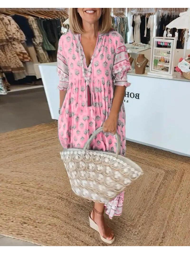 Blue Lumina Vancouver Estrella casual half-sleeve maxi dress displayed on a hanger showing its flowing fabric and relaxed fit.